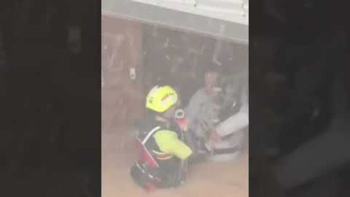 Dog and woman rescued from deadly floods in Spain